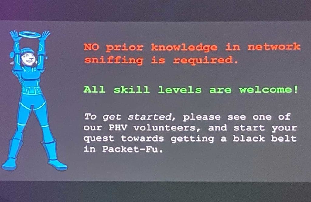 Slide from the Packet Hacking Village reading: "NO prior knowledge in network sniffing is required. All skill levels are welcome! To get started, please see one of our PHV volunteers, and start your quest towards getting a black belt in Packet-Fu."